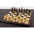 Complete 4-inch sleek Staunton luxury chess set in rosewood and boxwood set up in starting position on a wooden board.