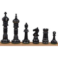 Set of hand-carved black camel bone chess pieces in British style.
