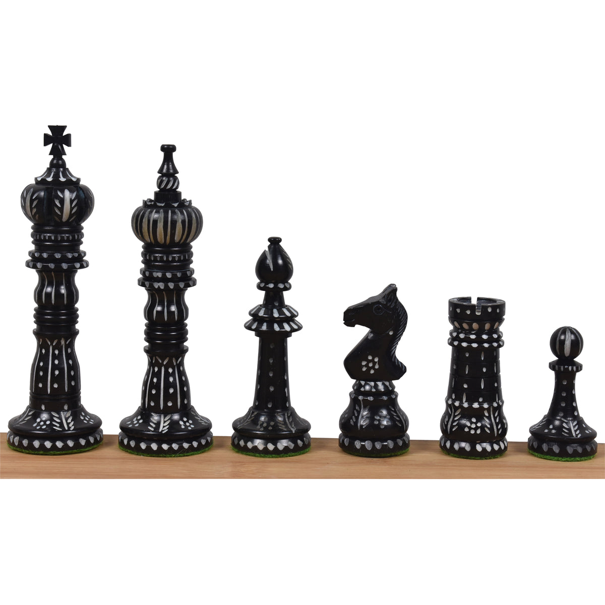 Set of hand-carved black camel bone chess pieces in British style.
