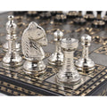 Detailed close-up of the polished silver Knight and Rook, showcasing their metallic shine and the texture of the engraved chessboard squares.