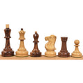 Soviet Großmeister Supreme chess pieces in golden rosewood and boxwood lined up by height.