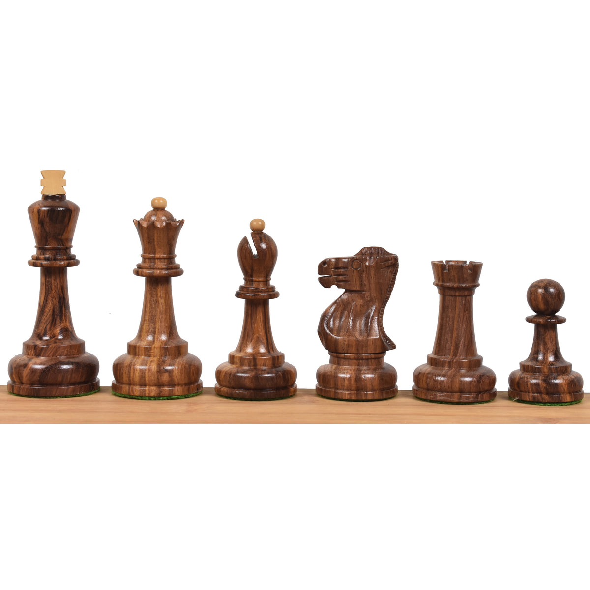Dark golden rosewood pieces of the Soviet Großmeister Supreme chess set displayed in a line.