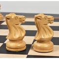 Two light boxwood knights of the Soviet Großmeister Supreme chess set facing each other on a chessboard.