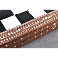 Close-up of the handcrafted floral white inlay work on the border of a premium Golden Rosewood chess board.