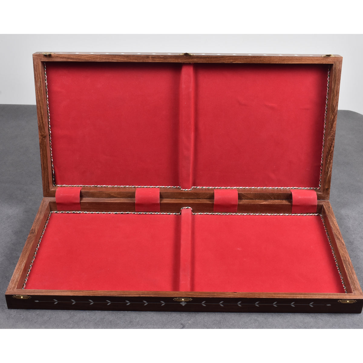 Interior storage view of the 24-inch folding chess board lined with protective red velvet felt for chess pieces.