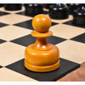 Detailed macro shot of an antiqued boxwood pawn from the reproduced 1960s Russian chess set.