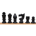 A complete lineup of black marble chess pieces.