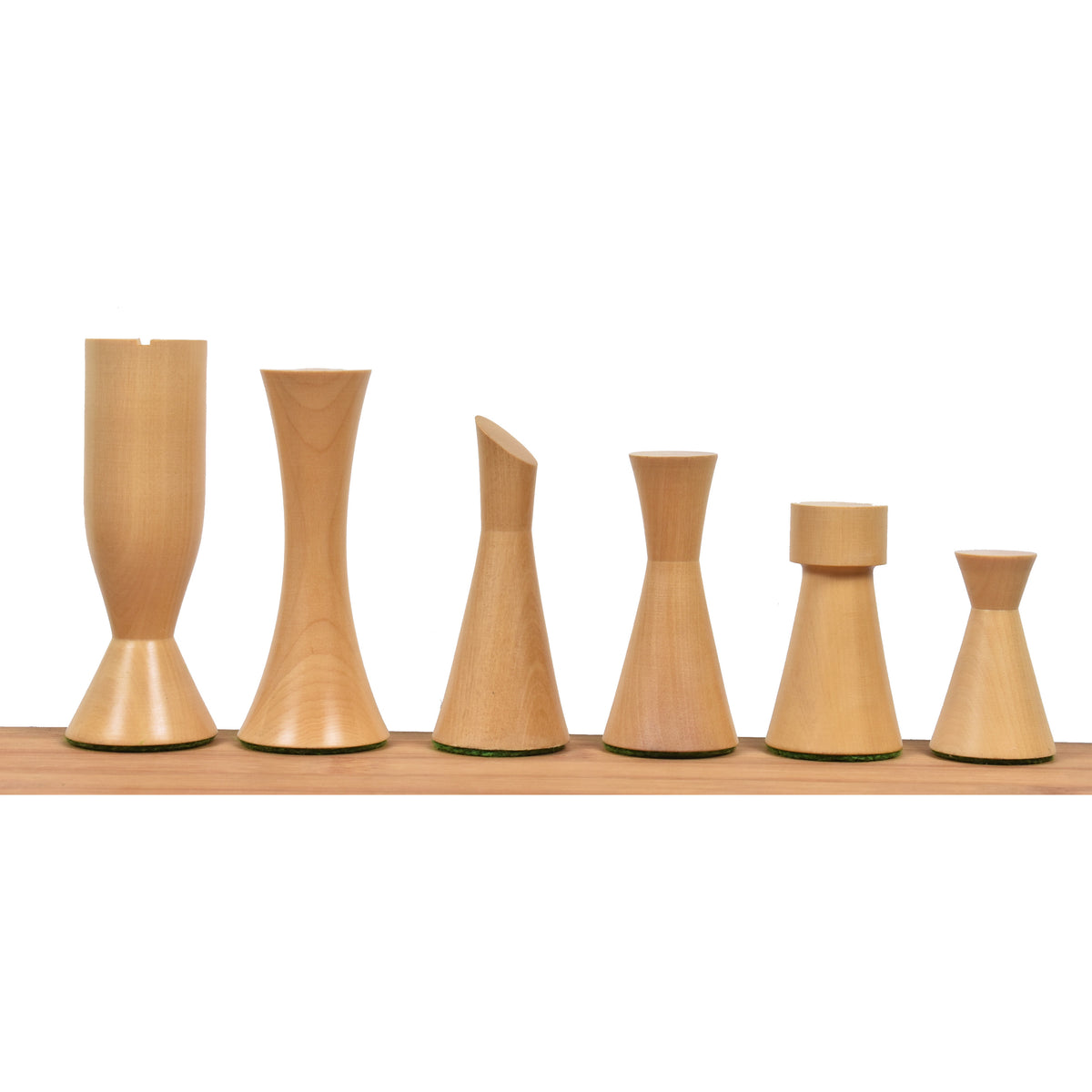 Lineup of white natural boxwood Minimalist Tower chess pieces ordered from King to pawn.