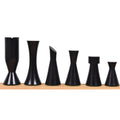 Six black ebonized boxwood Minimalist Tower chess pieces arranged by descending height.