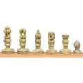 Lineup of handcarved green soapstone chess pieces showcasing king, queen, bishop, knight, rook, and pawn.