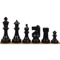 Complete sequence of black ebonized boxwood W.T. Pinney Staunton chess pieces displayed from King to Pawn.