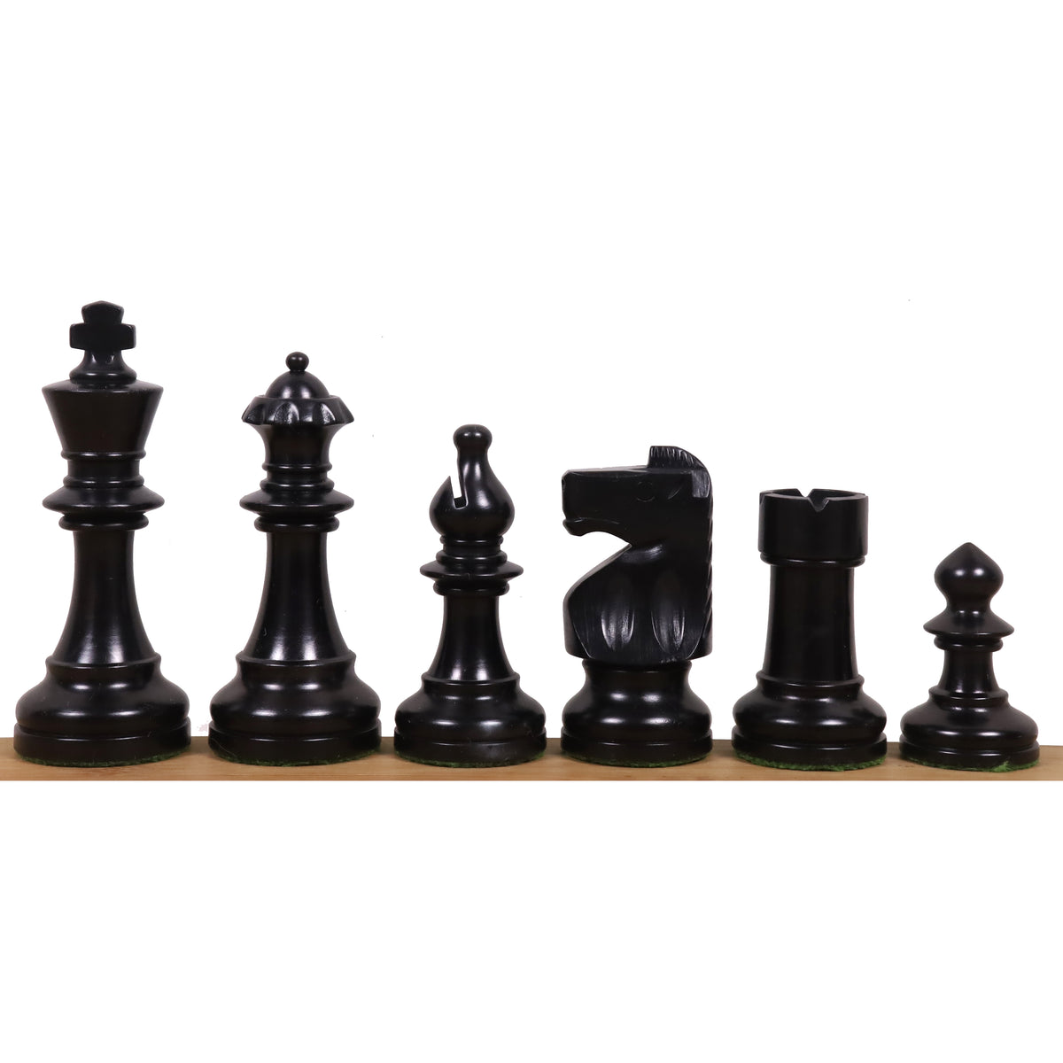 Complete sequence of black ebonized boxwood W.T. Pinney Staunton chess pieces displayed from King to Pawn.