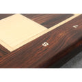 Close up of algebraic notation number 8 engraved on solid Rosewood chessboard border.
