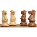 Detailed carving of four British Staunton knights, two in boxwood and two in golden rosewood.