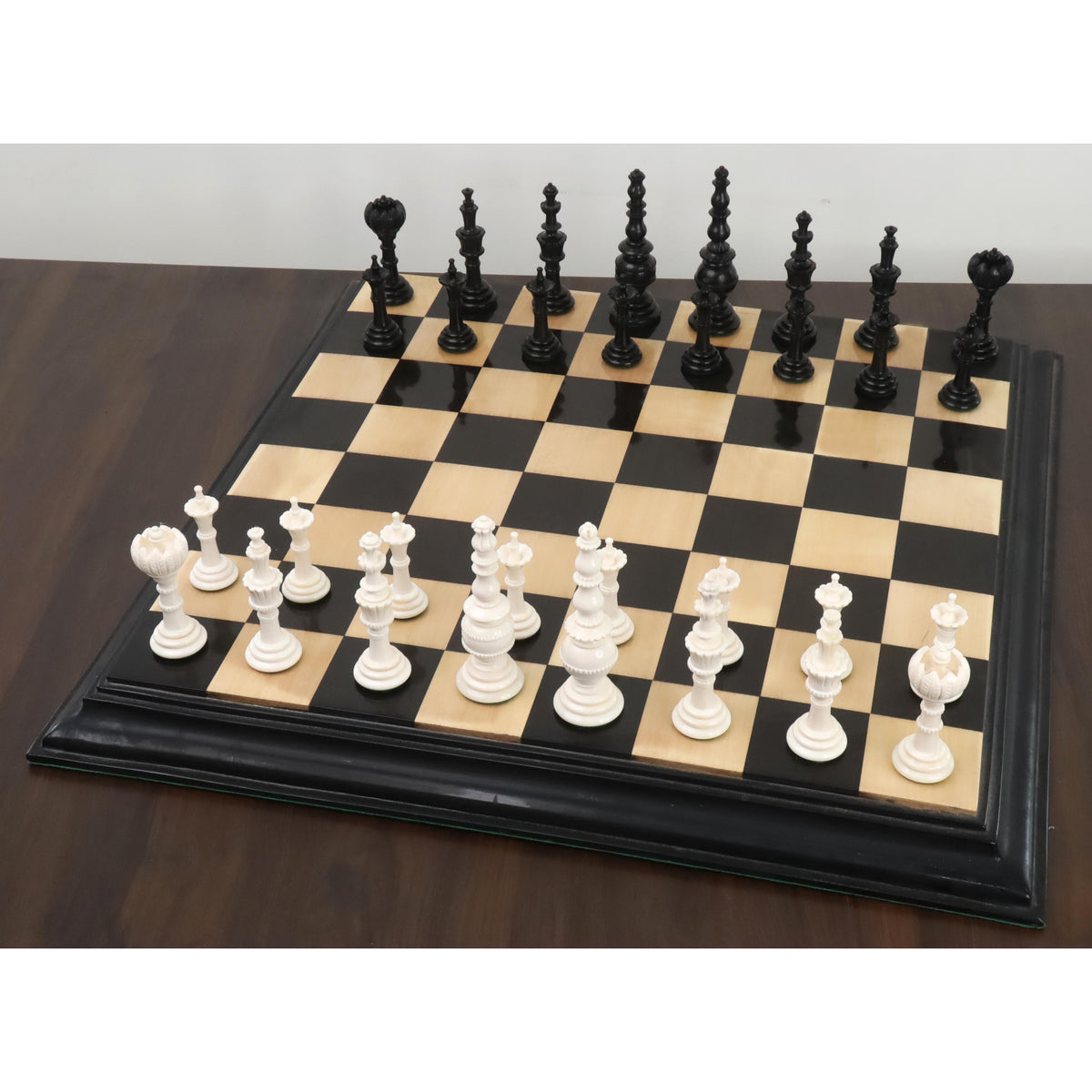 Turkish Tower pre-Staunton chess set arranged on a wooden chessboard
