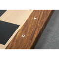Macro shot of laser-engraved algebraic notations on the border of an Ebony and Maple chessboard.