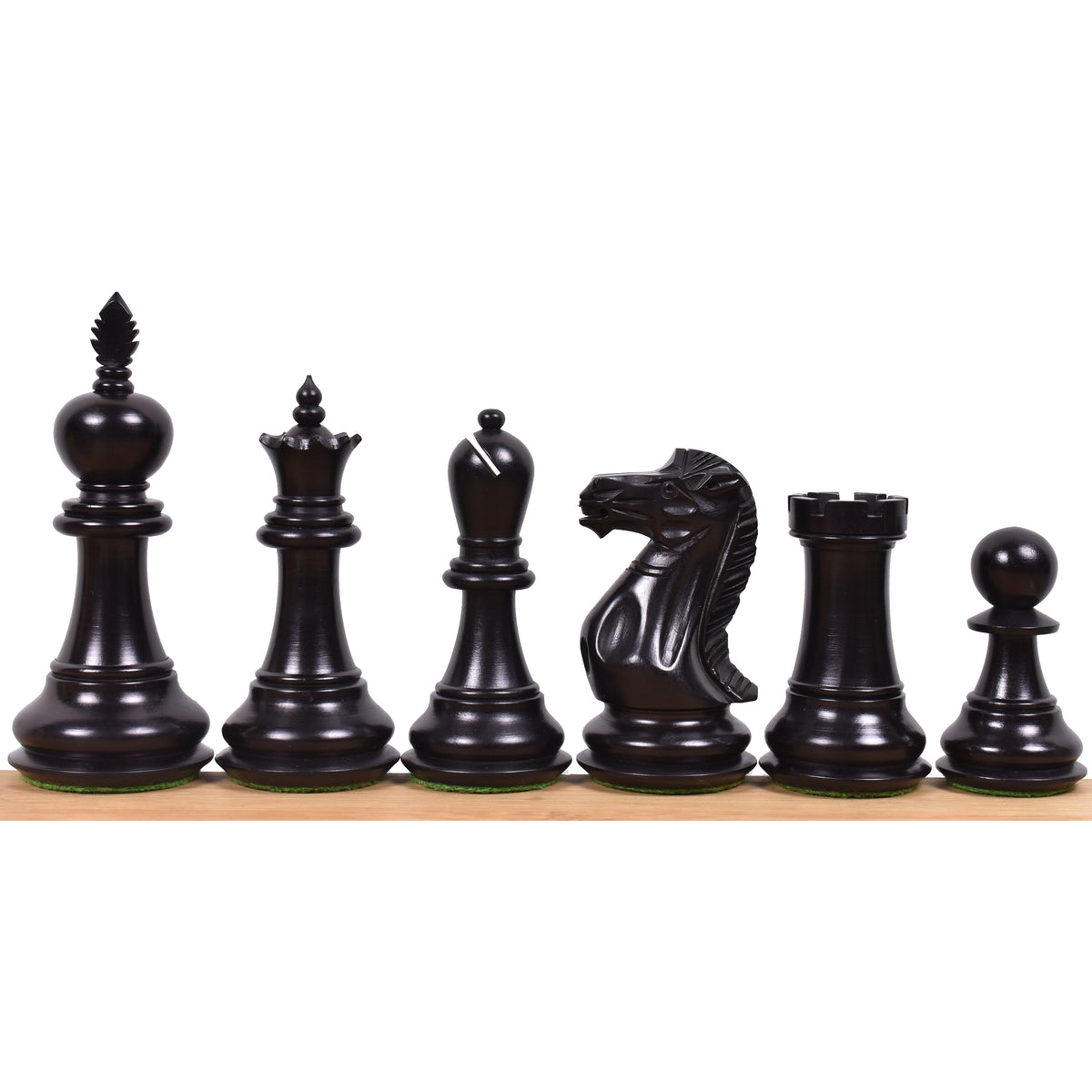 A complete side of dark ebonised boxwood executive staunton chess pieces.