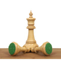 A tall Spartacus luxury Staunton king piece standing with two others fallen at the base.