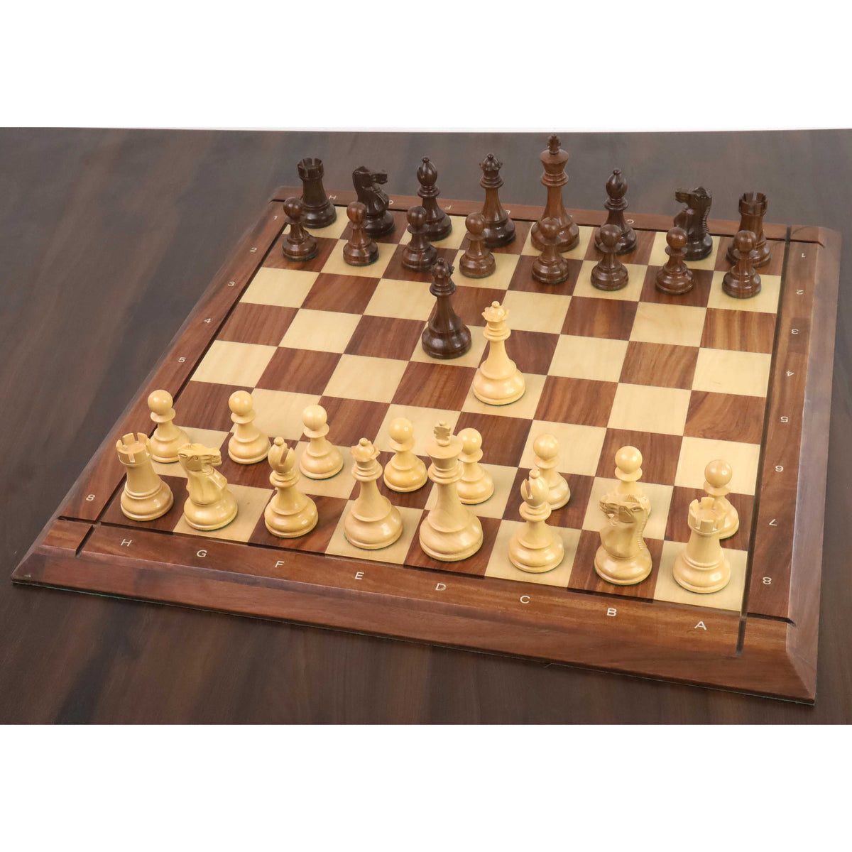 Complete New Classic Staunton golden rosewood chess set arranged in starting position on a board.