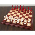 4.6" Turkish Tower pre-Staunton chess set arranged on a wooden board.