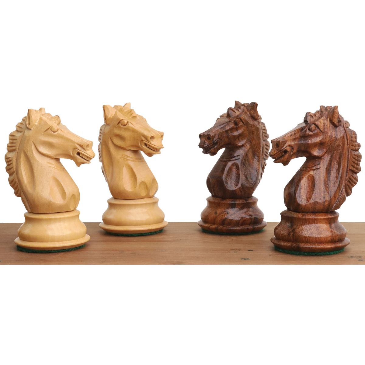 Detailed profile view of four hand-carved Alban knights in boxwood and golden rosewood.