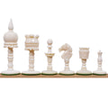 White natural camel bone English pre-Staunton chess pieces lined up in a row.