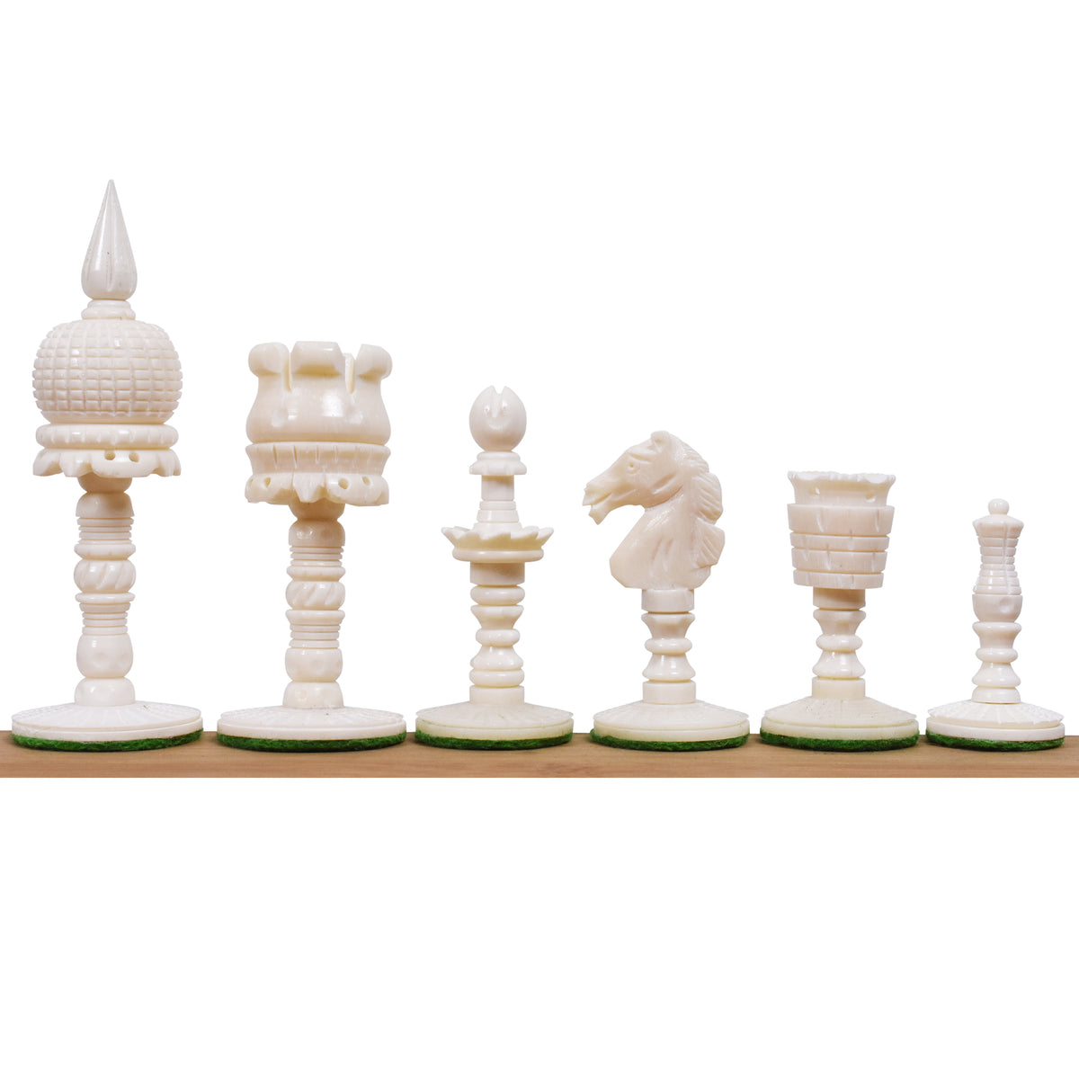 White natural camel bone English pre-Staunton chess pieces lined up in a row.