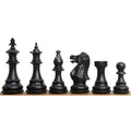 Black ebonised pieces of the 3.7" British Staunton weighted chess set arranged from king to pawn.
