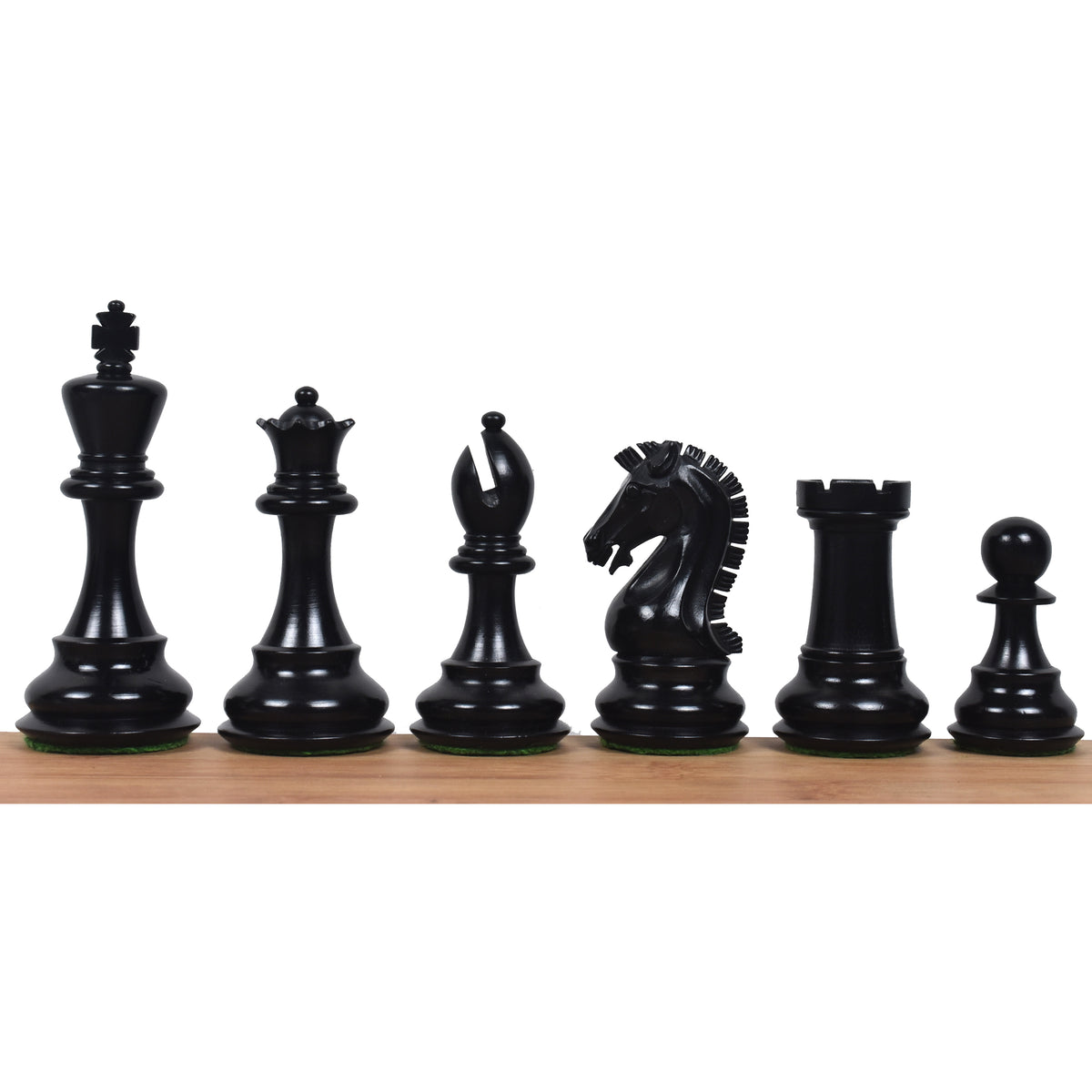 Dark ebonised boxwood pieces of the 3.9" Craftsman Staunton chess set lined up from King to pawn.