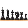 Hand-carved black ebony chess pieces from the Carvers' Art luxury collection.