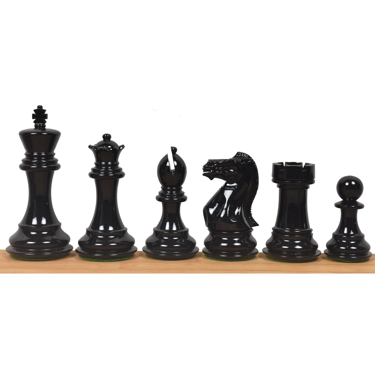 A profile lineup of the red painted boxwood chess pieces: King, Queen, Bishop, Knight, Rook, and Pawn.