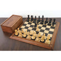 Full set of Pro Staunton chess pieces with a wooden storage box on the board.