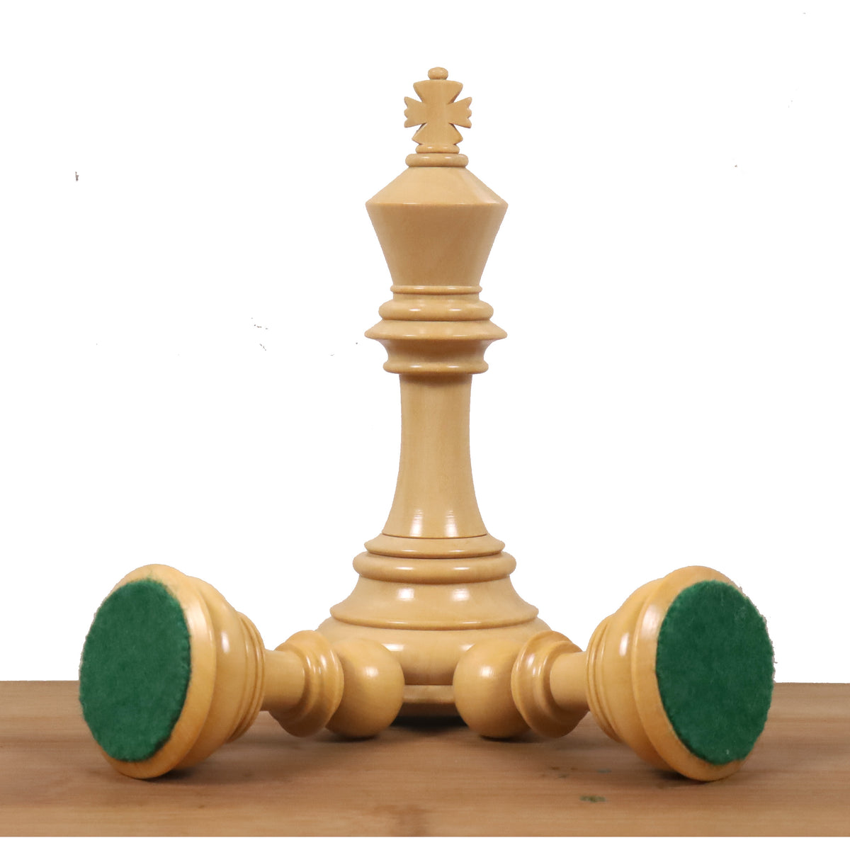 Triple king setup of a Bud Rosewood chess set, highlighting the green felted bases.