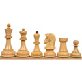 1970s Dubrovnik chess set pieces in contrasting Rosewood and Boxwood on a wooden surface.