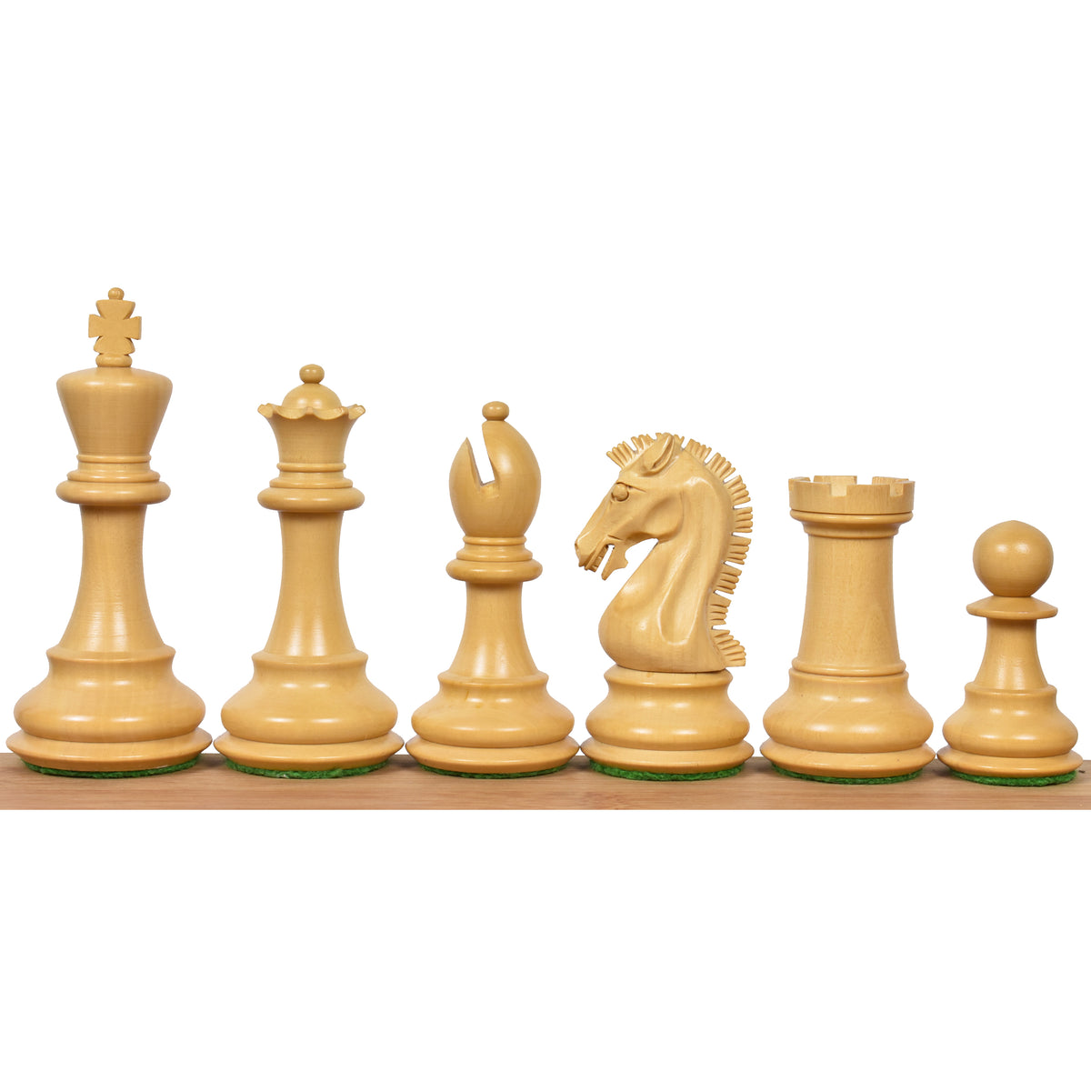 Six light boxwood 3.9" Craftsman Staunton chess pieces lined up from king to pawn on a wooden surface.