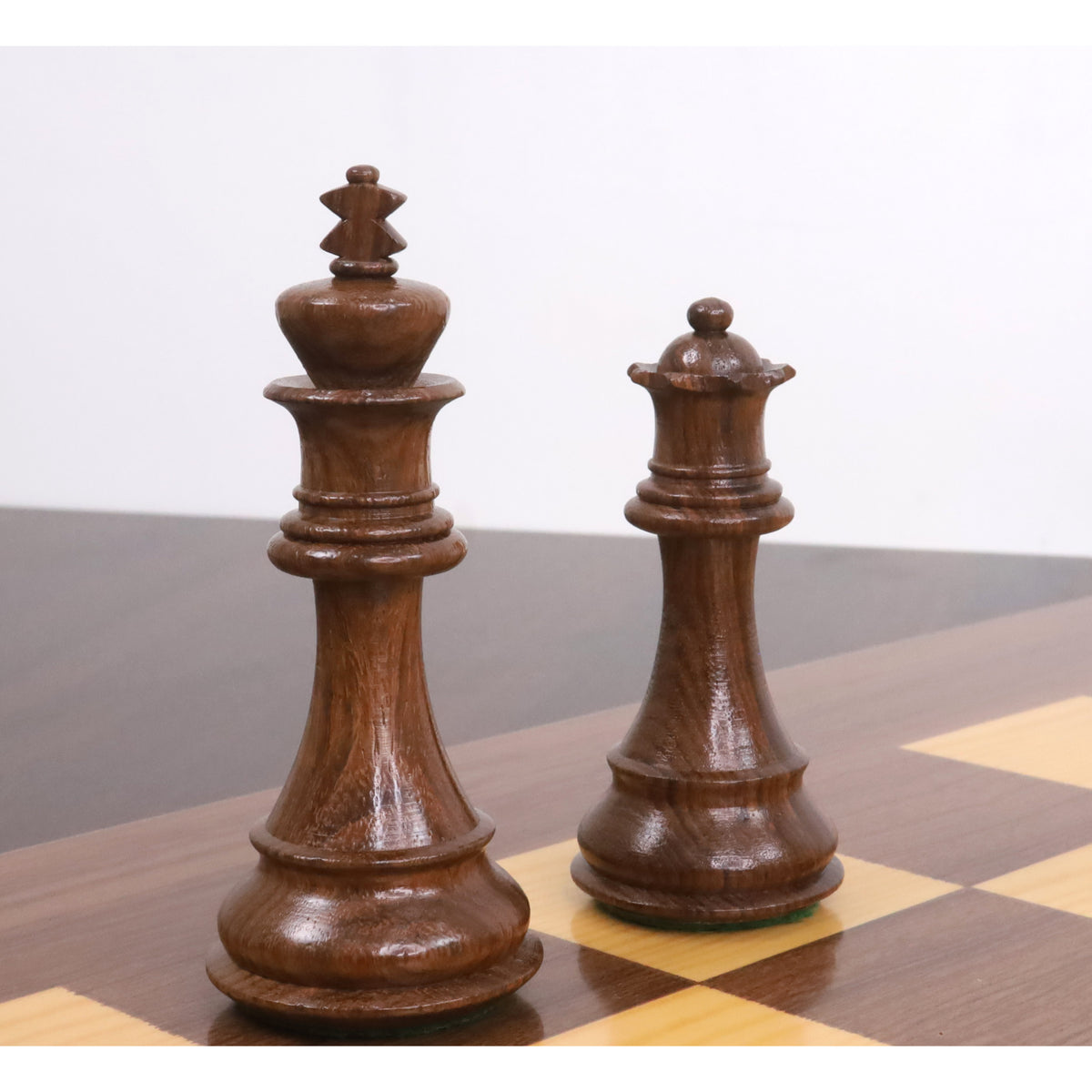 Luxury Bridle Staunton king and queen chess pieces crafted from premium golden rosewood.