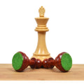 Weighted chess pieces featuring green felt pads on the base