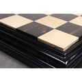 Detailed edge view of a handcrafted ebony and maple chess board.
