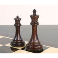 Dark rosewood king and queen from the 4-inch sleek Staunton luxury chess pieces, standing side-by-side on a glossy board.