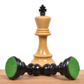 Green felt base on weighted ebonized pieces next to a boxwood Russian Zagreb king.