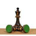 Bottom view of 1970s Dubrovnik chess pieces showing green felt bases for stability and scratch protection.