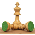 Boxwood Napoleon Staunton King piece with two fallen chessmen showing green felted bases.