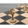 Highly detailed dark knight piece from the English Series Pre-Staunton antique camel bone chess set on a chessboard.