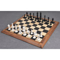 Minaret series hand-carved camel bone chess pieces set up fully on a wooden chess board.