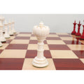 Single white Turkish Tower pre-Staunton chess piece on a board.