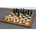 Full set of Spartacus luxury Staunton ebony wood chess pieces arranged on a wooden board.