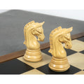 Close-up of two finely carved light knights from the 3.8" Imperial Staunton ebony chess pieces set on a board.