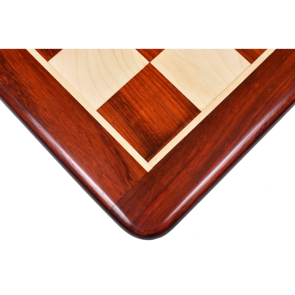 Close-up corner view of the 21-inch Bud Rosewood and Maple wood chess board highlighting the rich grain.
