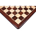 Symmetrical corner shot of a 21-inch rosewood and maple wood chess board highlighting the 55 mm square size.