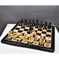 A full 4.2 inch executive staunton chess set arranged on a wooden board.